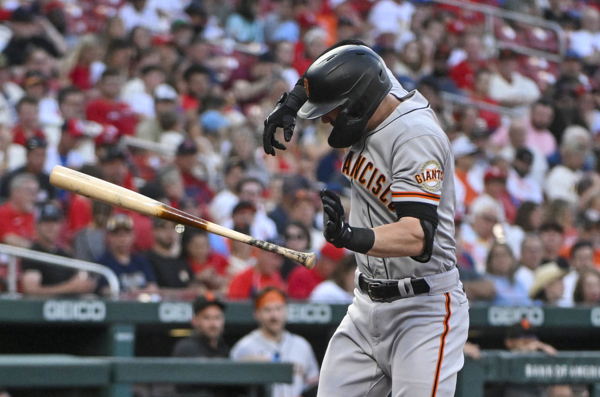 Mitch Haniger winces after Jack Flaherty's pitch breaks his forearm
